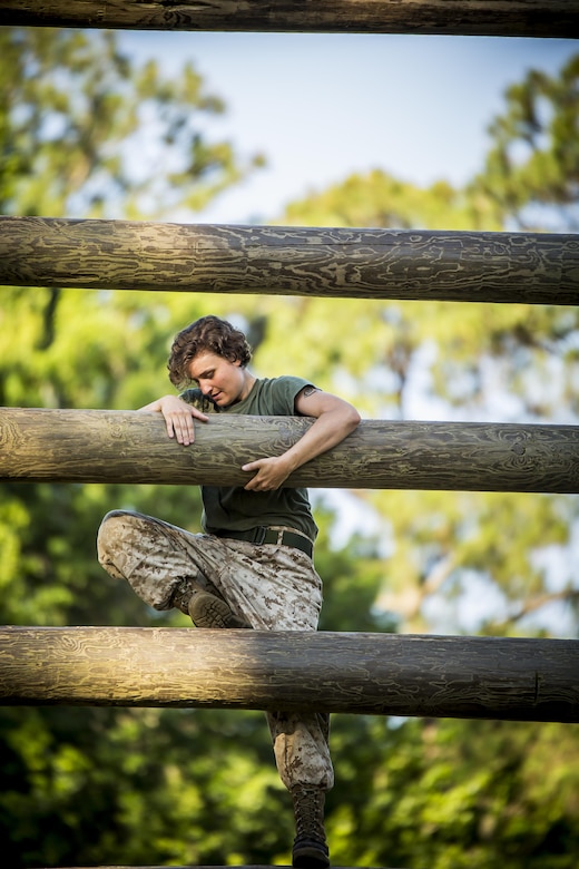 A Marine swims out of the water after falling from a rope obstacle at a confidence course in Marine Corps Recruit Depot Parris Island during a physical training event June 9. The Provost Marshal’s Office coordinated the event to challenge the Marines physically, build camaraderie and promote teamwork. Marines from every section of PMO participated in the event. The Marine is with PMO, Marine Corps Air Station Beaufort.