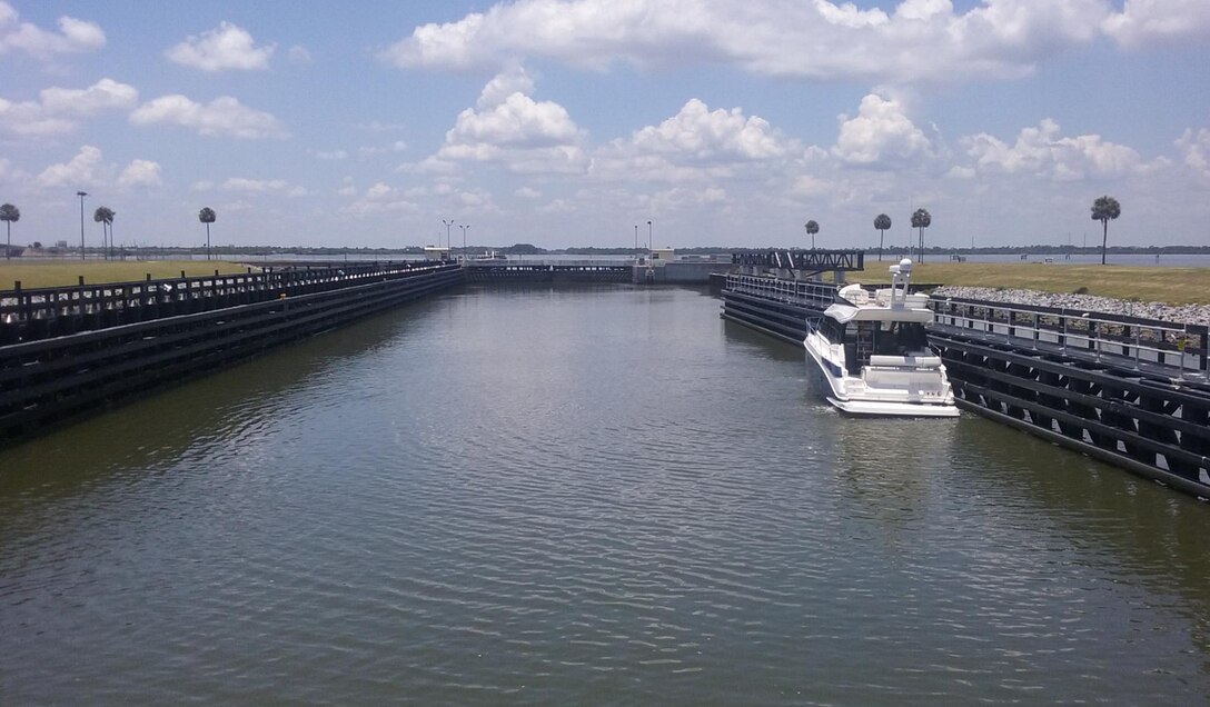 A boat navigates carefully through Canaveral Lock located at the western edge of the turning basin for Port Canaveral.  The U.S. Army Corps of Engineers recently completed repairs on the guide wall at the facilities and have resumed locking on demand between 6 a.m. and 9:30 p.m. seven days a week.