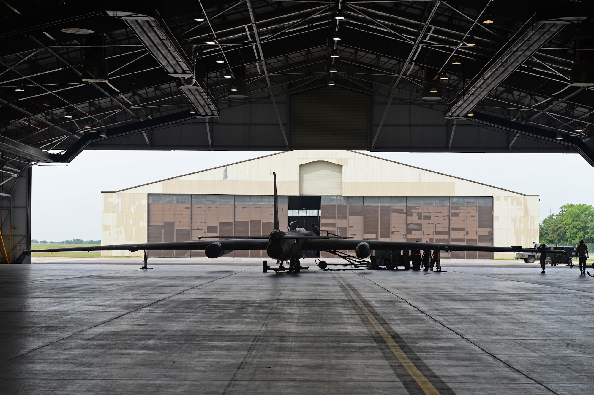 A U-2 Dragon Lady is inspected June 7, 2016, at Royal Air Force Fairford, Gloucestershire, England. The U-2 was met by Beale's en route recovery team (ERT) to perform maintenance before being sent to a forward operating location (FOL). (U.S. Air Force photo by Senior Airman Ramon A. Adelan)