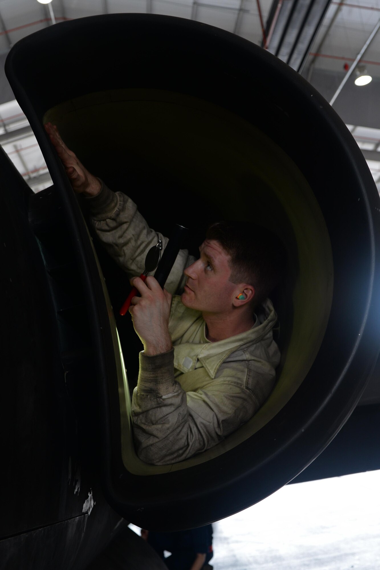 Senior Airman Ryan Raggio, 9th Aircraft Maintenance Squadron aerospace propulsion technician, performs a post-flight inlet inspection June 7, 2016, at Royal Air Force Fairford, Gloucestershire, England. Raggio was a member of Beale's en route recovery team (ERT), at RAF Fairford, which transitions aircraft from and to Beale Air Force Base, California, and forward operating locations (FOL). The ERT is used like a pit crew at the midway point in Fairford, ensuring the aircraft are prepared to make it to their next destination. (U.S. Air Force photo by Senior Airman Ramon A. Adelan)
