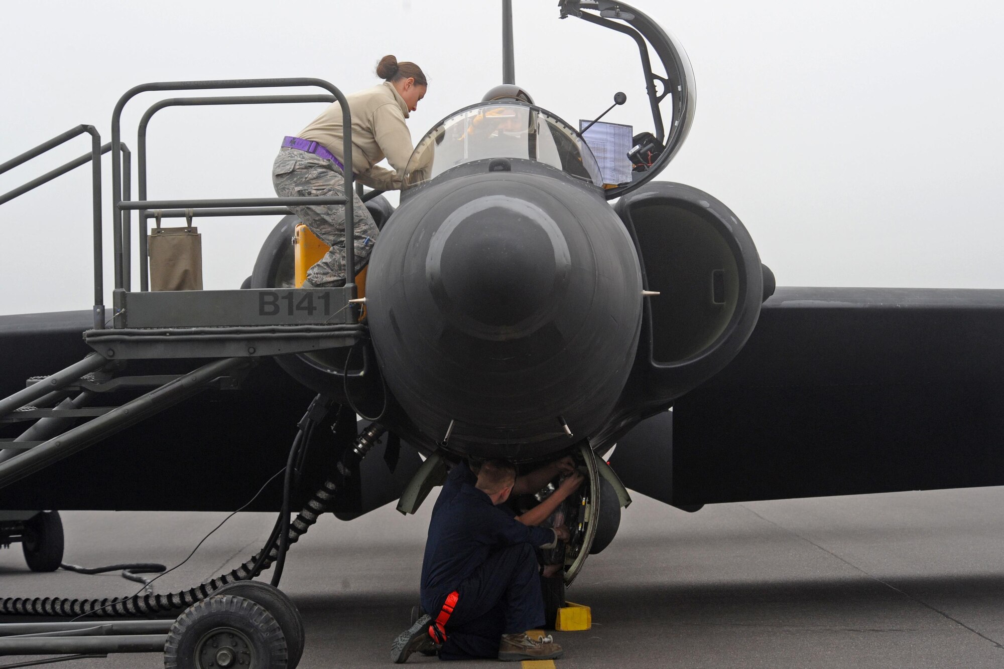 Staff Sgt. Julie Orellana (above), 9th Physiology Support Squadron launch and recovery technician, connects a pilot's life-support equipment to the aircraft, as Senior Airman Ryan Turnbull, 9th Aircraft Maintenance Squadron U-2 Dragon Lady dedicated crew chief, conducts a final pre-flight inspection June 9, 2016, at Royal Air Force Fairford, Gloucestershire, England. Orellana and Turnbull were members of Beale's en route recovery team (ERT), at RAF Fairford, which transitions aircraft from and to Beale Air Force Base, California, and forward operating locations (FOL). The ERT is used like a pit crew at the midway point in Fairford, ensuring the aircraft are prepared to make it to their next destination. (U.S. Air Force photo by Senior Airman Ramon A. Adelan)