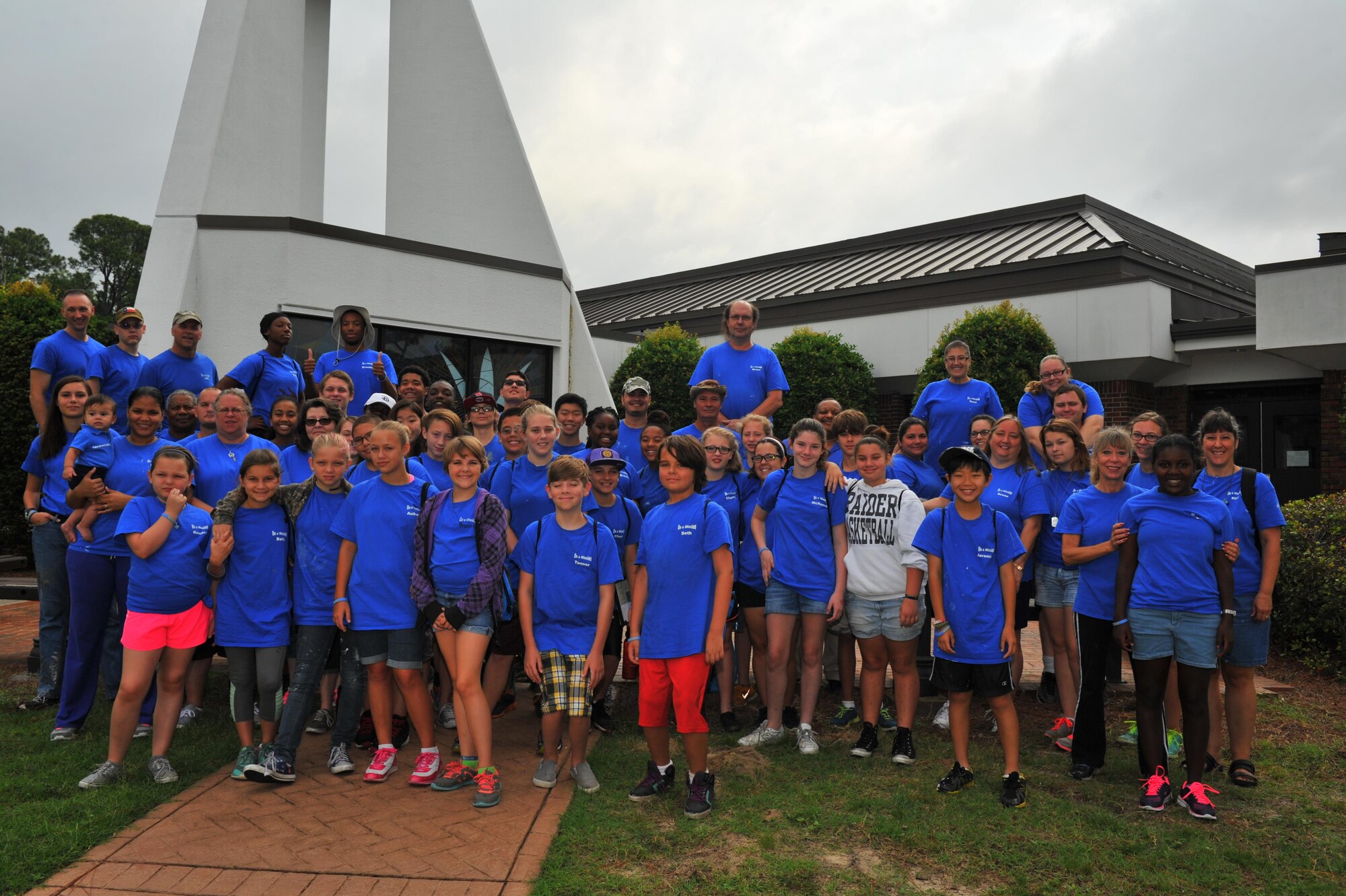 Hurlburt Field’s Special Operations Youth Group pose for a group photo outside of the chapel at Hurlburt Field, Fla., June 16, 2016. The group performed service and repair work at the Airman & Family Readiness Center, library, youth center, child development center, base pool and chapel, along with multiple off-base sites. (U.S. Air Force photo by Airman 1st Class Joseph Pick)

