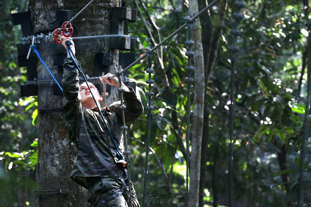 A soldier connects the safety line onto a rope obstacle at the French jungle warfare school in Gabon, June 7, 2016. The soldiers, assigned to the 3rd Infantry Division’s Company B, 3rd Battalion, 7th Infantry Regiment, 2nd Infantry Brigade Combat Team, are attending the school as part of Central Accord 2016, a U.S. Army Africa exercise bringing together partner nations to practice and demonstrate proficiency in peacekeeping operations. Army photo by Sgt. Henrique Luiz de Holleben