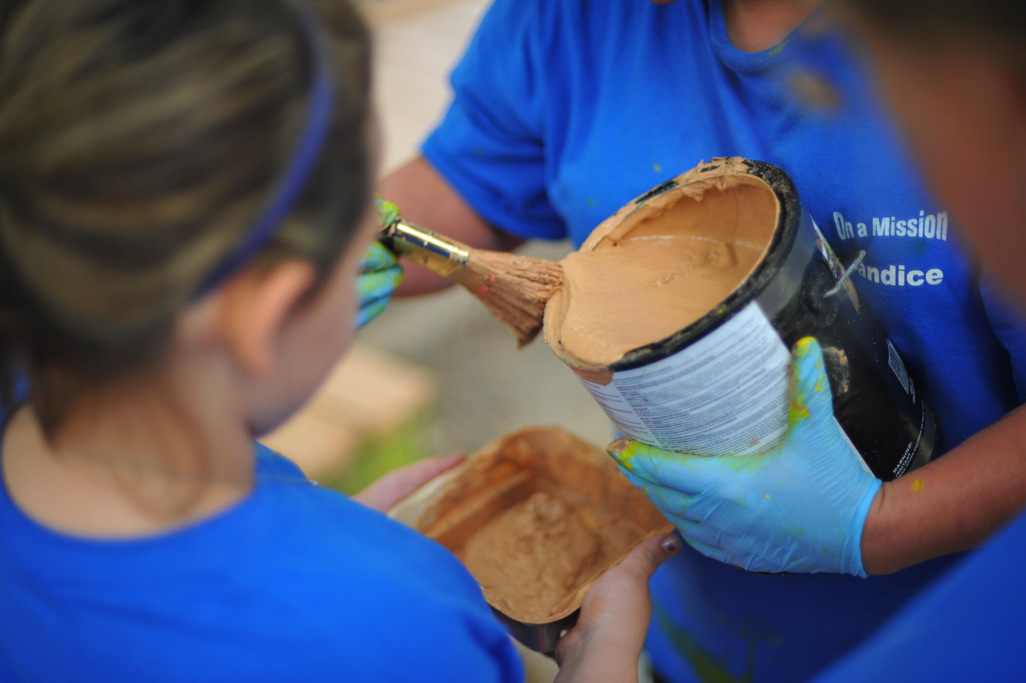 Volunteers with Hurlburt Field’s Special Operations Youth Group prepare to paint a deck outside of the library at Hurlburt Field, Fla., June 16, 2016. The youth group’s funding and manpower helped organizations who have challenges in these areas due to fiscal restraints and declining budgets. (U.S. Air Force photo by Airman 1st Class Joseph Pick)
