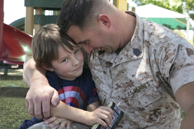 Gunnery Sgt. Ira Heide works hard to balance his duties as a Marine and his obligations as a single parent. He has served as a Marine for 16 years and as a father for seven to his son, Jessen.