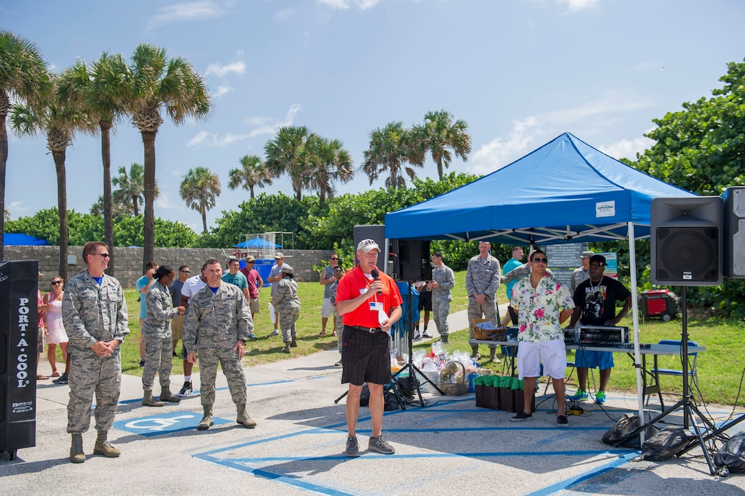 Stu Smith, Cocoa Beach Regional Chamber of Commerce Military Affairs Council chair; thanks each branch of the military service during the 28th annual Junior Enlisted Appreciation Picnic June 17, 2016, at Patrick Air Force Base, Fla. The MAC is an all-volunteer group of the Chamber Partners from the local Space Coast area, both military and civilian, who work together to better both communities. (U.S. Air Force photo/Matthew S. Jurgens/Released) 