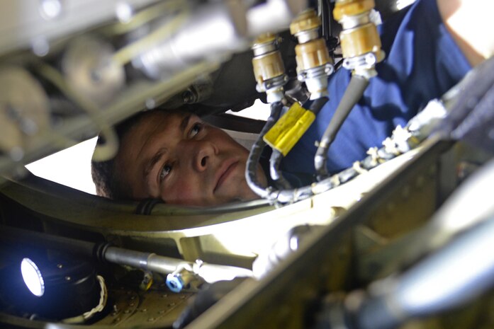 Airman 1st Class Aaron Nymeyer, 9th Aircraft Maintenance Squadron U-2 Dragon Lady dedicated crew chief, replaces a hydraulic seal on a U-2 Dragon Lady June 8, 2016, at Royal Air Force Fairford, Gloucestershire, England. Nymeyer was a member of Beale's en route recovery team (ERT), at RAF Fairford, which transitions aircraft from and to Beale Air Force Base, California, and forward operating locations (FOL). The ERT is used like a pit crew at the midway point in Fairford, ensuring the aircraft are prepared to make it to their next destination. (U.S. Air Force photo by Senior Airman Ramon A. Adelan)