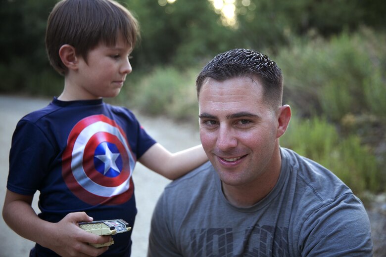 Gunnery Sgt. Ira Heide works hard to balance his duties as a Marine and his obligations as a single parent. He has served as a Marine for 16 years and as a father for seven to his son, Jessen.