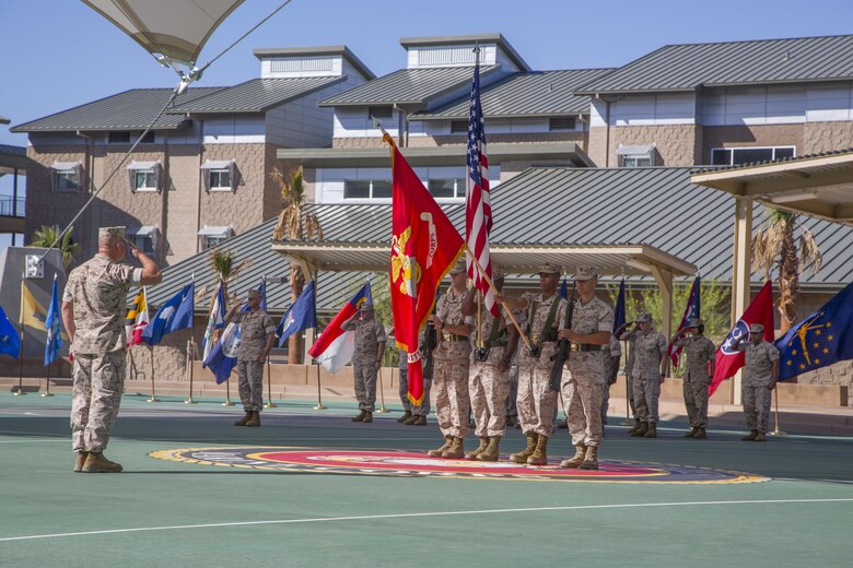 Marines with Marine Corps Logistics and Operations Group salute during the playing of the national anthem as part of the unit’s change of command ceremony at the Dunham Amphitheater June 13, 2016. During the ceremony, Col. Matthew Cook relinquished command of MCLOG to Col. Jason Beaudoin. (Official Marine Corps photo by Lance Cpl. Alysa Jesse/Released)