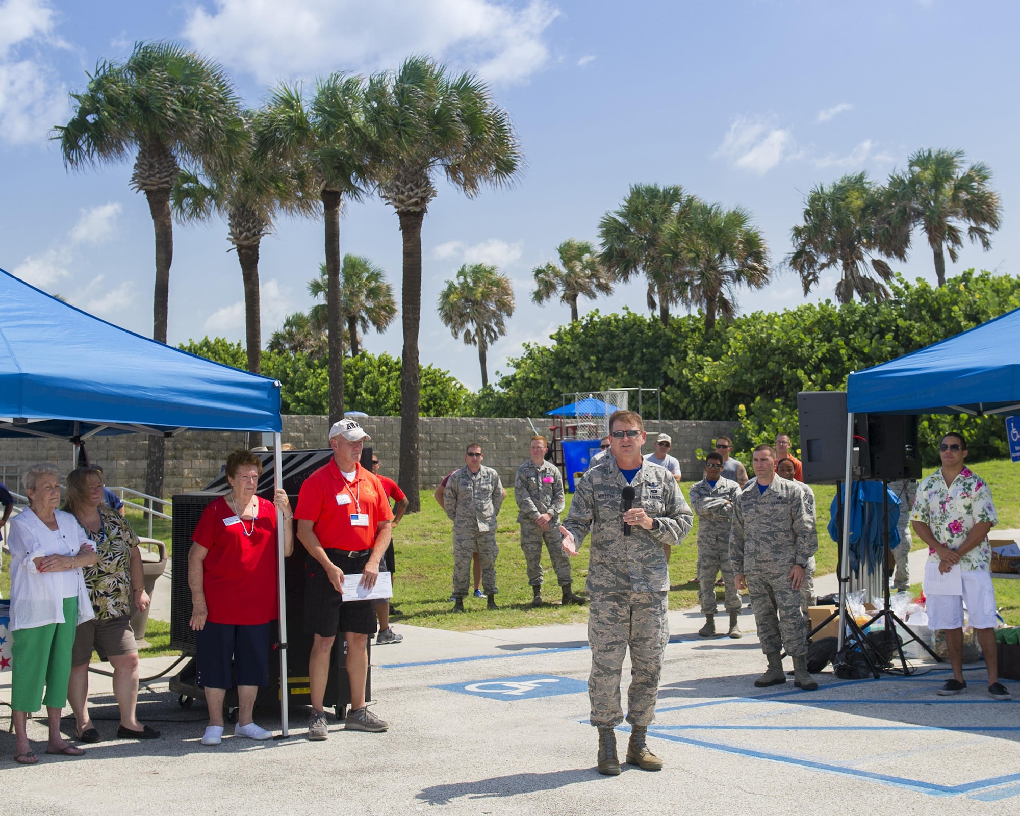 Brig. Gen. Wayne Monteith, 45th Space Wing commander, welcomes attendees to the 2016 Junior Enlisted Appreciation Picnic June 17, 2016, at Patrick Air Force Base, Fla. The commander thanked the council and the local community for their ongoing support to all service members and their families. (U.S. Air Force photo/Matthew S. Jurgens/Released)    
