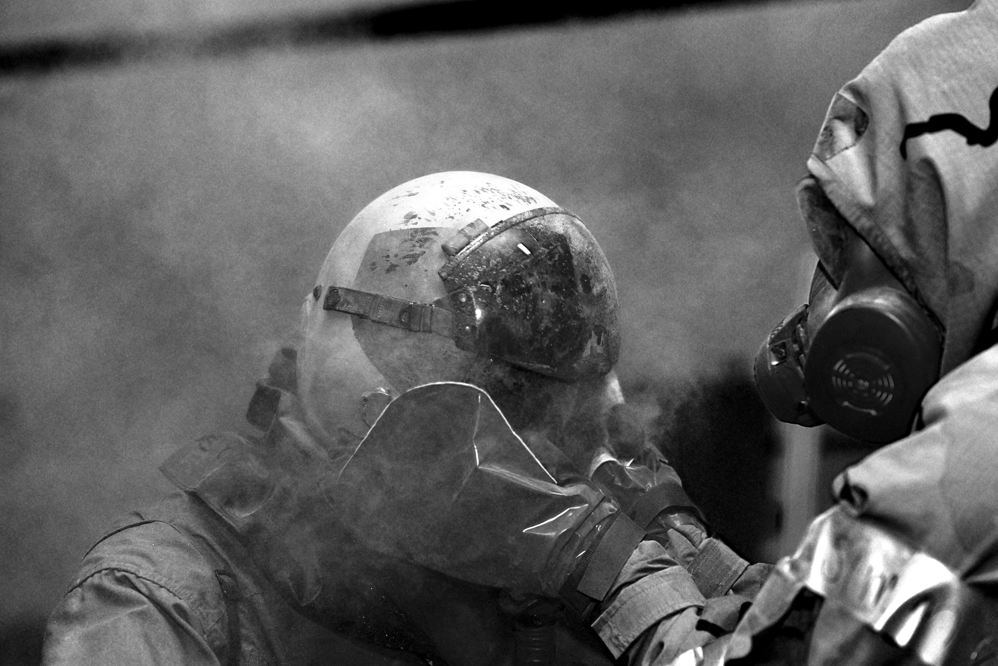 An aircrew member gets patted down with activated charcoal June 9 during decontamination processing exercise hosted by Air Force Special Operations Command. Airmen from eight southern U.S. bases participated in a realistic, scenario-based, training program held June 6-10 at Hurlburt Field, Fla. (U.S. Air Force photo / Staff Sgt. Melanie Holochwost)