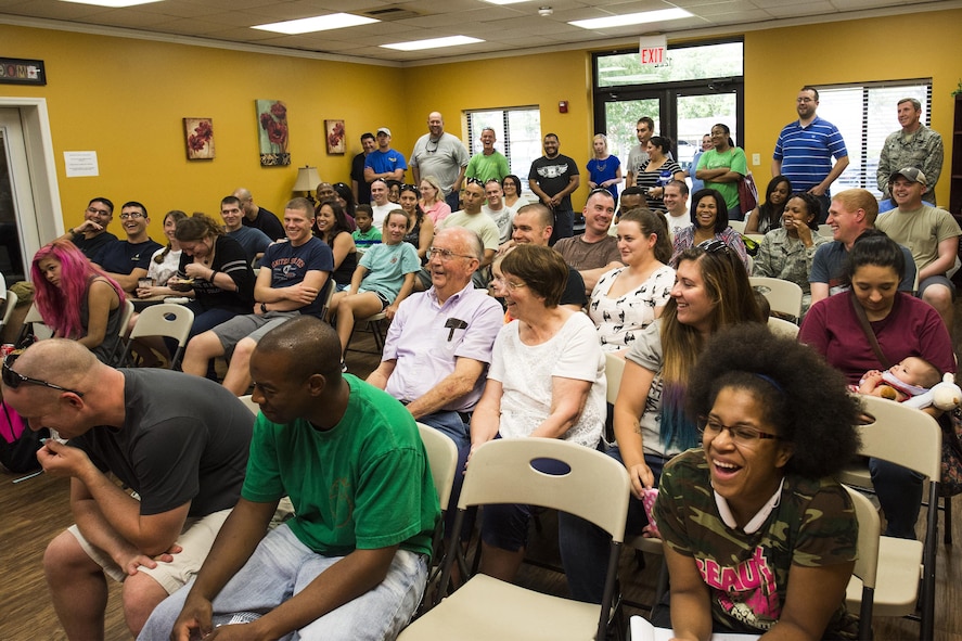 Residents of Quiet Pines, Magnolia Grove, and the surrounding area share a laugh during a town hall meeting, June 14, 2016, at Moody Air Force Base, Ga. It was recently announced that new internet providers are working to get internet back in Moody’s base housing during the meeting. (U.S. Air Force photo by Airman Daniel Snider/Released)