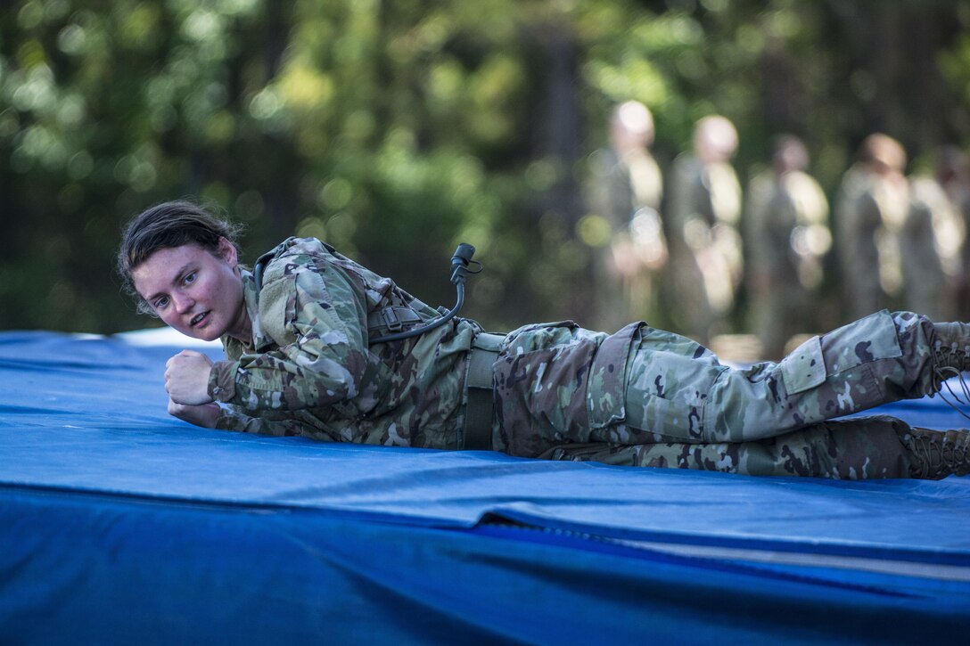 Soldiers roll off a mat after descending 30-feet onto a cargo net on Victory Tower at Fort Jackson, S.C., June 8, 2016. Army photo by Sgt. 1st Class Brian Hamilton 