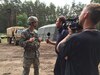 U.S. Army Reserve Pfc. James Hale, a Transportation Management Coordinator with the 3882nd Combat Sustainment Support Battalion, Joint Base Lewis-McChord, Washington, is interviewed by a Polish television reporter during Exercise Anakonda 2016 at the Drawsko Pomorskie Training Area, Poland, June 14. Hale, the son of American missionaries, was born in Poland and has lived most of his life there. He has served as a Polish translator for the soldiers in his unit during their time in Poland. Exercise Anakonda 2016 is a Polish-led, joint multinational exercise taking place throughout Poland June 7-17. The exercise involves approximately 31,000 participants from more than 20 nations. Exercise Anakonda 2016 is a premier training event for U.S. Army Europe and participating nations and demonstrates the United States and partner nations can effectively unite under a unified command while training on contemporary scenario. (U.S. Army photo by Timothy L. Hale) (Released)