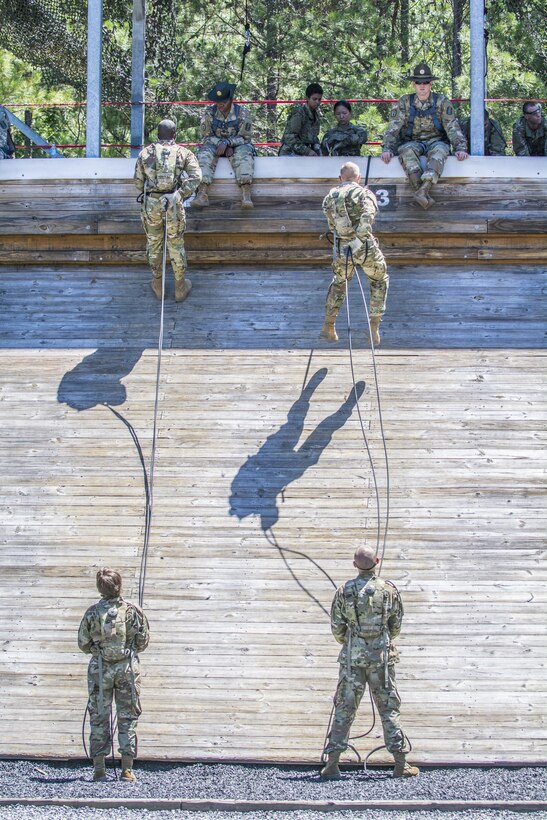 Army drill sergeants observe soldiers rappel down a 20-foot mini-wall at Fort Jackson, S.C., June 8, 2016. Army photo by Sgt. 1st Class Brian Hamilton