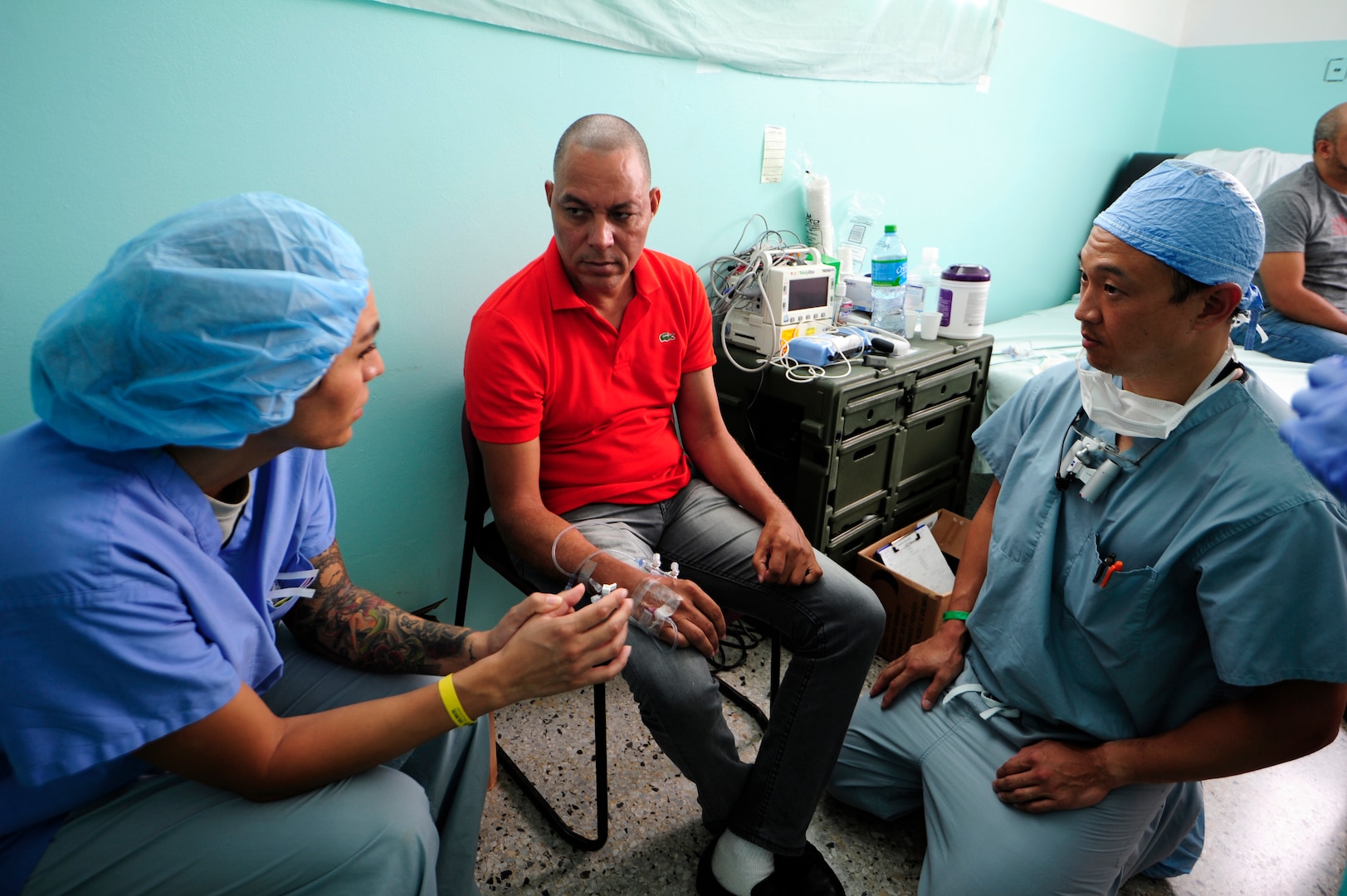 (l-r) Staff Sgt. Isela Gonzalez, 506th Air Expeditionary Group chaplain assistant, translates to Alberto Rosario for Maj. Peter Rhee, 506th Expeditionary Medical Operations Squadron hand surgeon, during a Medical Readiness Training Exercise or MEDRETE as part of NEW HORIZONS 2016. In the span of two-weeks, the orthopedic medical team has treated more than 420 patients and provided 26 specialized orthopedic surgeries. Rhee is deployed from the 59th Medical Wing, Joint Base San Antonio, Texas. (U.S. Air Force photo by Master Sgt. Chenzira Mallory/released)