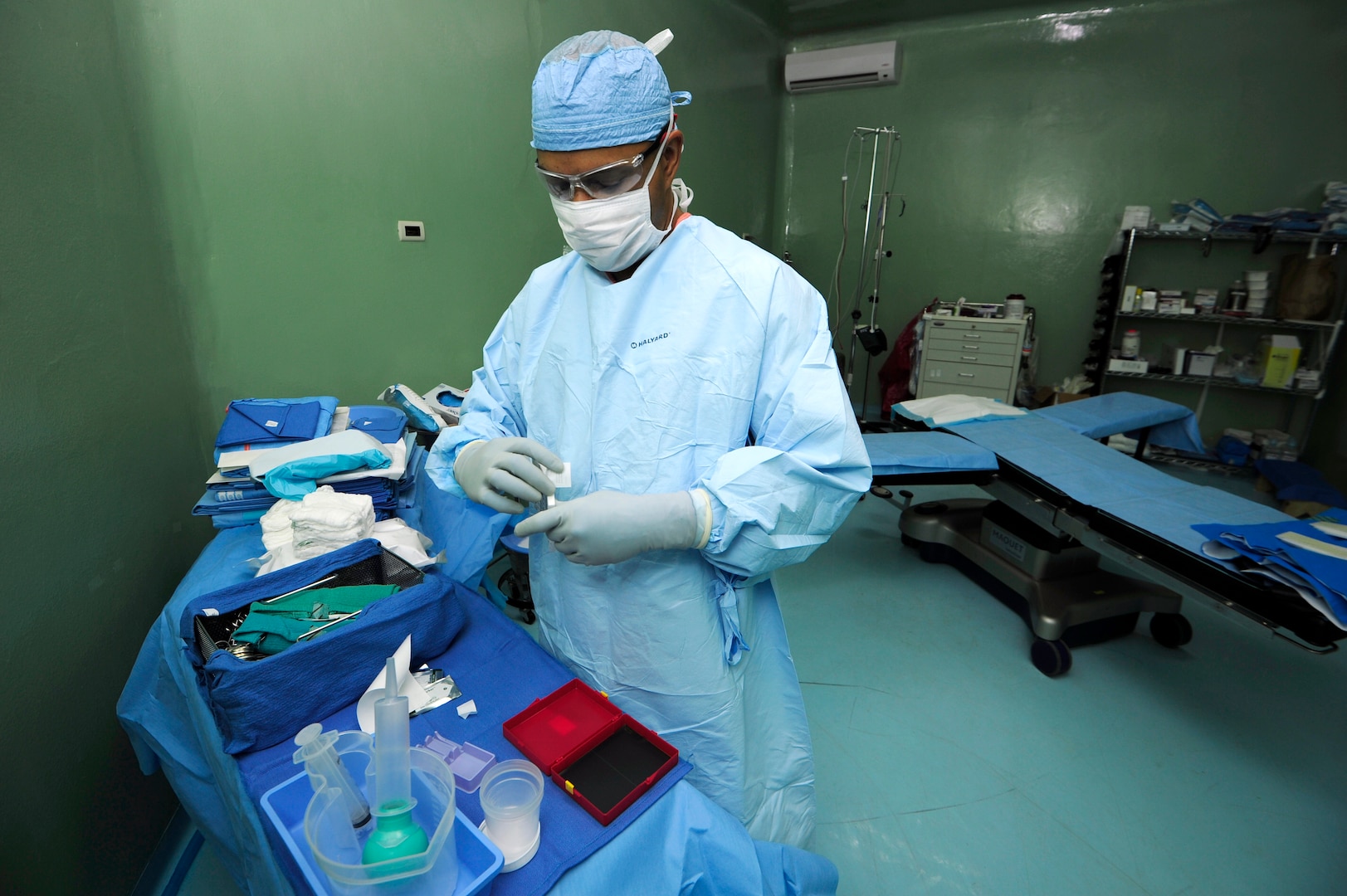 Master Sgt. Shawn Elmandorf, 506th Expeditionary Medical Operations orthopedic technician, prepares tools for a surgery, during a Medical Readiness Training Exercise or MEDRETE, June 8, at Rio San Juan hospital, Dominican Republic. The MEDRETE, which is part of the Exercise NEW HORIZONS 2016, provides an opportunity for U.S. military doctors and technicians to practice their craft in a deployed environment. Elmandorf is deployed from the 59th Medical Wing, Joint Base San Antonio, Texas. (U.S. Air Force photo by Master Sgt. Chenzira Mallory/released)