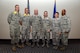 Wearing over-sized novelty ranks, new major, lieutenant colonel and colonel selects stand for a group photo at the Event Center on Goodfellow Air Force Base, June 16, 2016. The 17th Training Wing hosted a recognition ceremony to honor them for their accomplishment. (U.S. Air Force photo by Staff Sgt. Laura R. McFarlane/Released) 