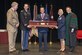 Lt. Col. Erik Weitzel is presented the Gold Headed Cane by retired Lt. Gen. Eric Schoomaker, Brooke Army Medical Center Commander Col. Jeffrey Johnson, Col. Rachel Lefebvre, and Dr. Woodson "Scott" Jones, dean, San Antonio Uniformed Services Health Education Consortium, during the SAUSHEC awards and graduation ceremony in downtown San Antonio, June 10, 2016. (U.S. Air Force photo/Senior Airman Krystal Wright)