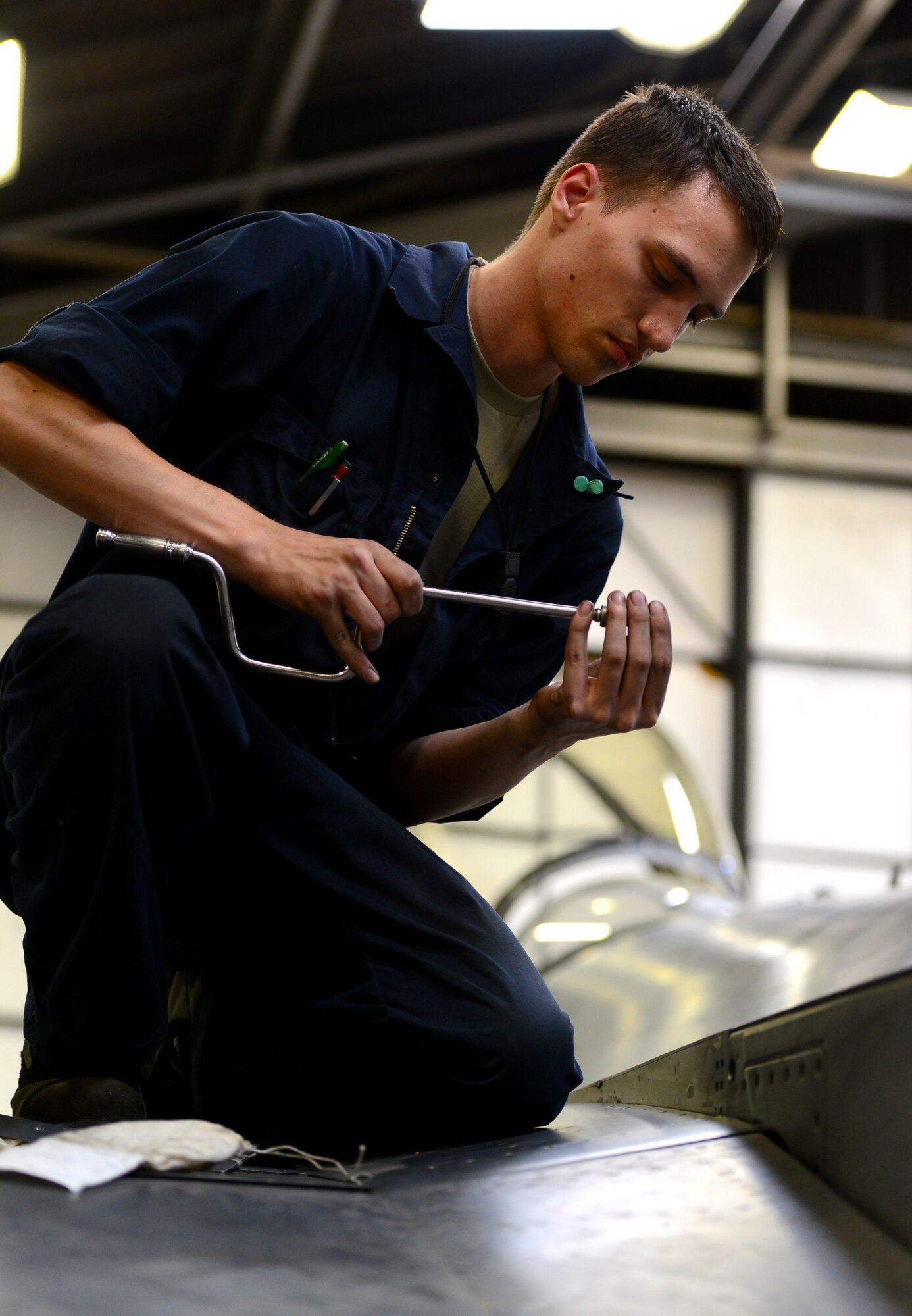 Airman 1st Class Andrew Pakulak, 56th Equipment Maintenance Squadron inspection section team member, installs the wing root faring on an F-16 Fighting Falcon June 15, 2016, at Luke Air Force Base, Ariz. The inspection section thoroughly inspects aircraft for discrepancies, fix then ops check all major systems and subsystems, and return safe and reliable aircraft back  for another 400 hours of training the world's greatest F-16 fighter pilots. (U.S. Air Force photo by Tech. Sgt. Timothy Boyer) 