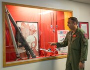 U.S. Air Force Lt. Col. Julio Rodriguez, the 18th Aggressor Squadron (AGRS) director of operations, explains the significance of Red Air during large scale exercises and training Blue Air pilots June 15, 2016, during RED FLAG-Alaska (RF-A) 16-2 at Eielson Air Force Base, Alaska. The 18th AGRS use a red star, overlaid by a target on the sleeves of their green flight suits and red flags with the hammer and sickle of the former Soviet Union, to mark the mission of being experts in enemy tactics in exercises such as RF-A, a U.S. Pacific Air Forces commander-directed exercise, which has helped train more than 150,000 aircrew members for combat in the past 40 years. (U.S. Air Force photo by Staff Sgt. Shawn Nickel/Released)

