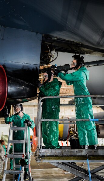 Crew chiefs from the 2nd Maintenance Squadron clean an engine pod during a pre-phase inspection wash at Barksdale Air Force Base, La., June 15, 2016.  The aircraft was washed prior to a phase inspection to help maintainers detect cracks and other potential issues that could compromise the airframe. (U.S. Air Force photo/Senior Airman Mozer O. Da Cunha) 
