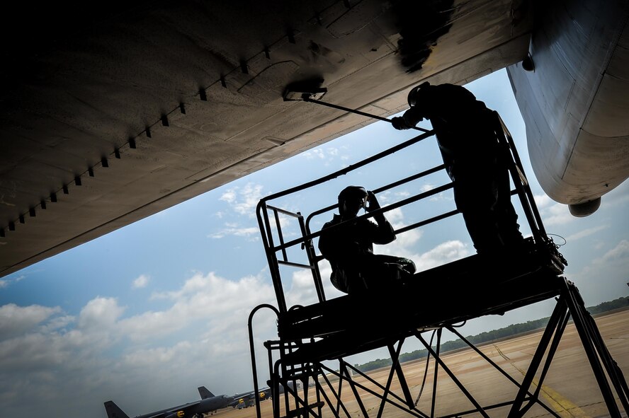 Senior Airman Kyle Harvey [Left], and Staff Sgt. Matthew Thrift [Right], 2nd Maintenance Squadron crew chiefs, scrub a B-52 Stratofortress horizontal stabilizer during a pre-phase inspection wash at Barksdale Air Force Base, La., June 15, 2016. The horizontal stabilizer and other outer parts of the airframe were washed to prevent corrosion and to increase the lifespan of the aircraft.  (U.S. Air Force Photo/Senior Airman Mozer O. Da Cunha)