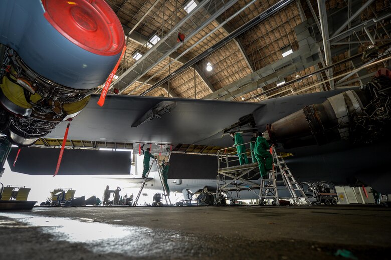 Crew chiefs from the 2nd Maintenance Squadron wash a B-52 Stratofortress prior to a phase inspection at Barksdale Air Force Base, La., June 15, 2016. Airmen secured critical areas of the airframe and disconnected electrical systems to prevent water and cleaning supplies from causing any damage to the aircraft. Engine shrouds were also removed to facilitate the process. (U.S. Air Force photo/Senior Airman Mozer O. Da Cunha)