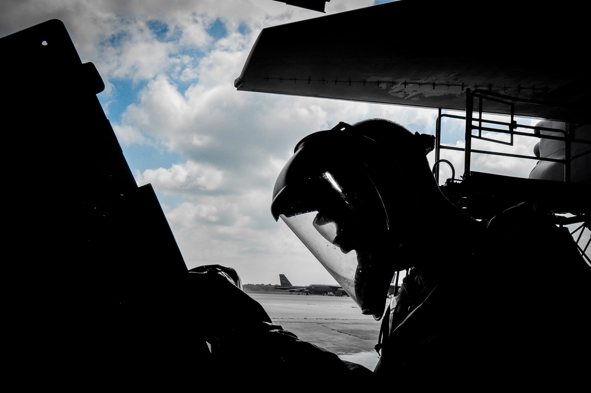 A propulsion technician with the 2nd Maintenance Squadron cleans a transducer box cover during a pre-phase inspection wash at Barksdale Air Force Base, La., June 15, 2016. The jet wash included a team of Airmen from various specialties such as crew chiefs, propulsion, communications, navigation and guidance and control technicians, each working on their designated sections. (U.S. Air Force photo illustration/Senior Airman Mozer O. Da Cunha)