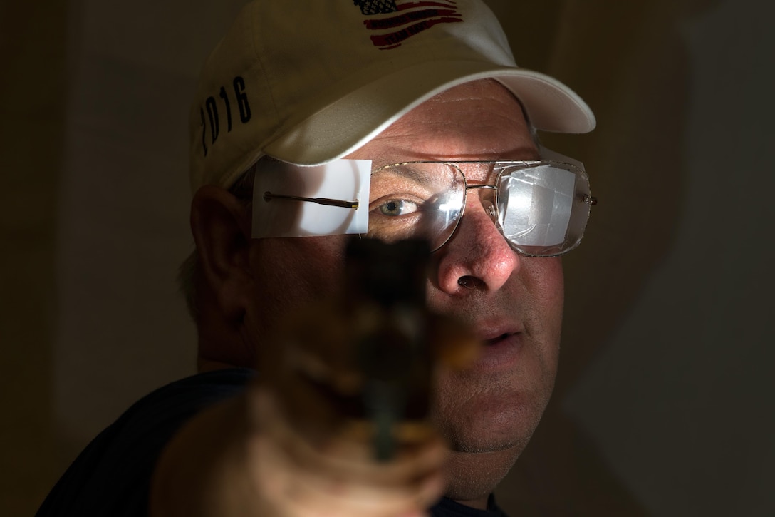 Medically retired Navy Petty Officer 1st Class Robert Dodd poses with the air pistol that he’ll use during competition at the 2016 Department of Defense Warrior Games at the U.S. Military Academy in West Point, N.Y., June 15, 2016. DoD photo by EJ Hersom