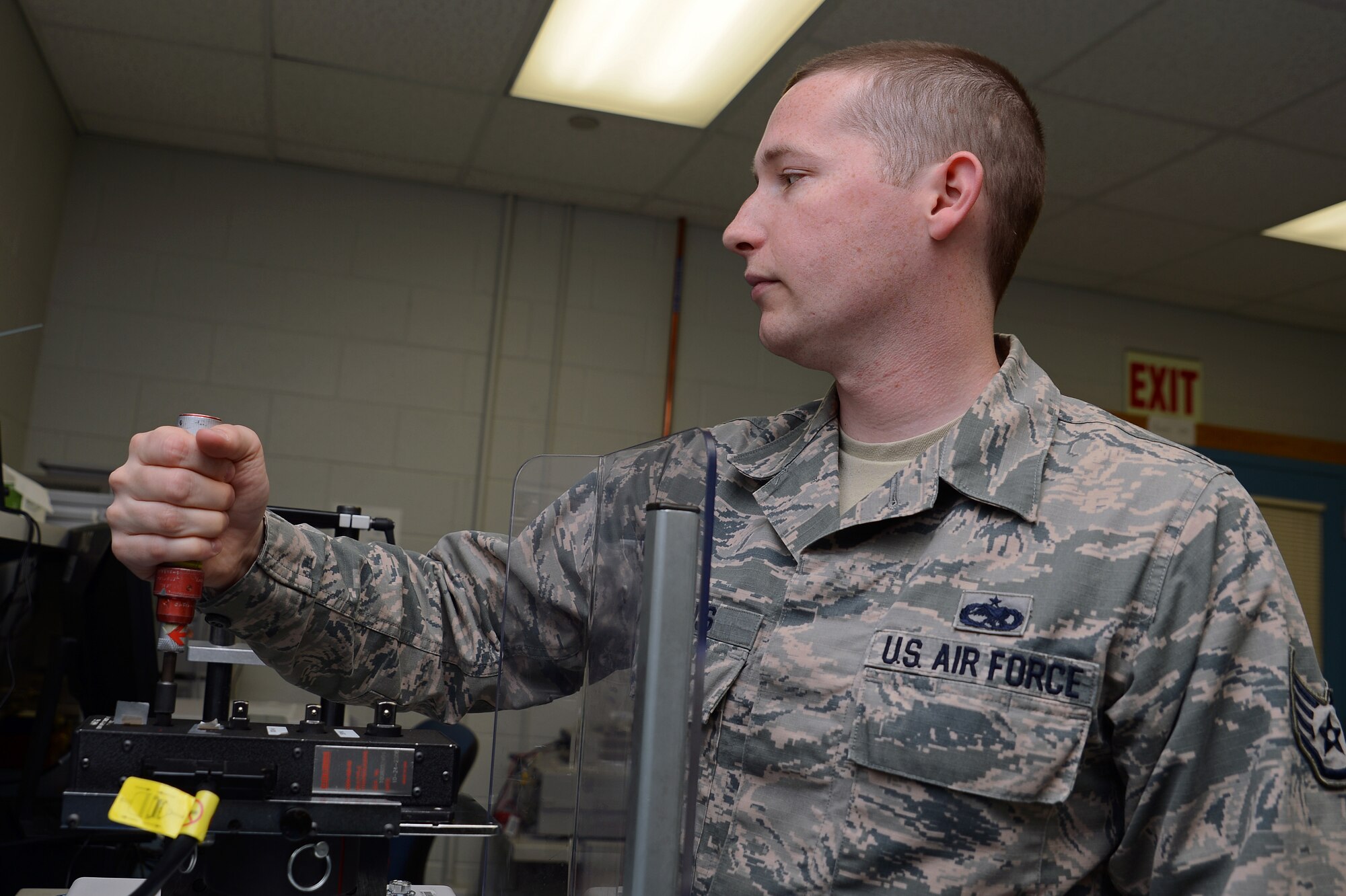 Staff Sgt. Jacob Burns, 62nd Maintenance Squadron precision measurement equipment laboratory supervisor, calibrates a torque wrench June 7, 2016 at Joint Base Lewis-McChord, Wash. The PMEL shop is responsible for calibrating equipment that is used in virtually every phase of maintenance on McChord Field and throughout numerous government organizations in the Pacific Northwest. (U.S. Air Force photo/Senior Airman Jacob Jimenez)  