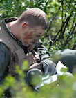 U.S. Air Force Capt. Keli Kaaekuahiwi, an A-10 pilot assigned to the 354th Fighter Squadron out of Davis-Monthan Air Force Base, Ariz., translates information during a personnel recovery exercise at a training site in the Joint Pacific Alaska Range Complex, June 14, 2016, during RED FLAG-Alaska (RF-A) 16-2. RF-A is a series of Pacific Air Forces commander-directed field training exercises for U.S. and partner nation forces, enabling joint and international units to sharpen their combat skills in a realistic threat environment inside the Joint Pacific Alaska Range Complex, which at more than 67,000 square miles, is the largest instrumented air, ground and electronic combat training range in the world. (U.S. Air Force photo by Master Sgt. Karen J. Tomasik/Released)