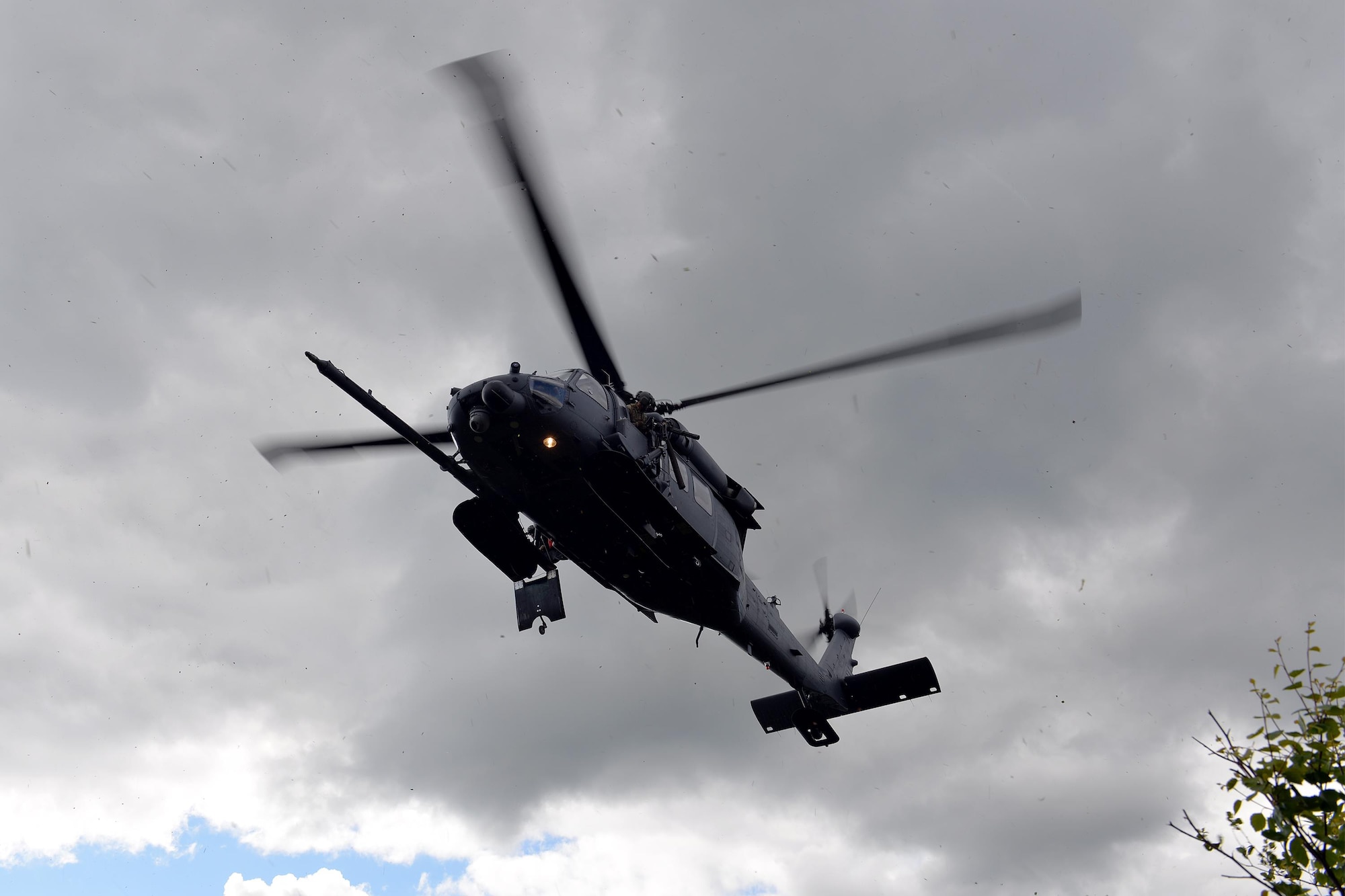 An HH-60G Pave Hawk helicopter and rescue crew assigned to the Alaska Air National Guard's 210th Rescue Squadron Detachment 1 approaches a pilot waiting at an extraction site inside the Joint Pacific Alaska Range Complex, as part of a personnel recovery exercise June 14, 2016, during RED FLAG-Alaska 16-2. The primary goal of the 353rd Combat Training Squadron's personnel recovery division is to develop effective rescue scenarios for joint and international forces, which provides unique opportunities for to integrate various forces into joint, coalition and multilateral training from simulated forward operating bases. (U.S. Air Force photo by Master Sgt. Karen J. Tomasik)