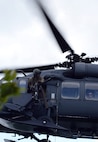 A U.S. Air Force flight engineer gunner assigned to the Alaska Air National Guard's 210th Rescue Squadron (RQS) Detachment (Det) 1 watches for opposing forces as his HH-60G Pave Hawk rescue helicopter approaches a pilot waiting for extraction inside the Joint Pacific Alaska Range Complex as part of a personnel recovery exercise June 14, 2016, during RED FLAG-Alaska (RF-A) 16-2. The 210th RQS Det 1, based at Eielson Air Force Base, Alaska, provides a crucial support role for potential alert incidents during RF-A exercises, which can occur in the more than 67,000 square mile area known as the Joint Pacific Alaska Range Complex. (U.S. Air Force photo by Master Sgt. Karen J. Tomasik)