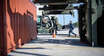 Aviation boatswain handler 2nd class Seth Townsend, Navy Cargo Handling Battalion THIRTEEN, operates a fork lift to move training cargo June 10, 2016, at Joint Base Charleston – Air Base, S.C. This training was a part of NCHB13s Exercise Golden Steamboat. This exercise is a high-tempo exercise intended to significantly increase unit readiness and individual qualifications in preparation for the battalion’s Unit Level Training Readiness Assessment 2017, the unit’s large-scale exercise. (U.S. Air Force photo/Senior Airman Clayton Cupit)