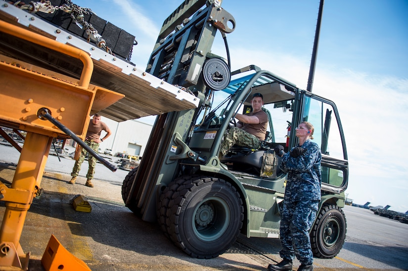 Aviation boatswain handler 2nd class Seth Townsend, Navy Cargo Handling Battalion THIRTEEN, operates a fork lift to move training cargo June 10, 2016, at Joint Base Charleston – Air Base, S.C. This training was a part of NCHB13s Exercise Golden Steamboat. This exercise is a high-tempo exercise intended to significantly increase unit readiness and individual qualifications in preparation for the battalion’s Unit Level Training Readiness Assessment 2017, the unit’s large-scale exercise. (U.S. Air Force photo/Senior Airman Clayton Cupit)