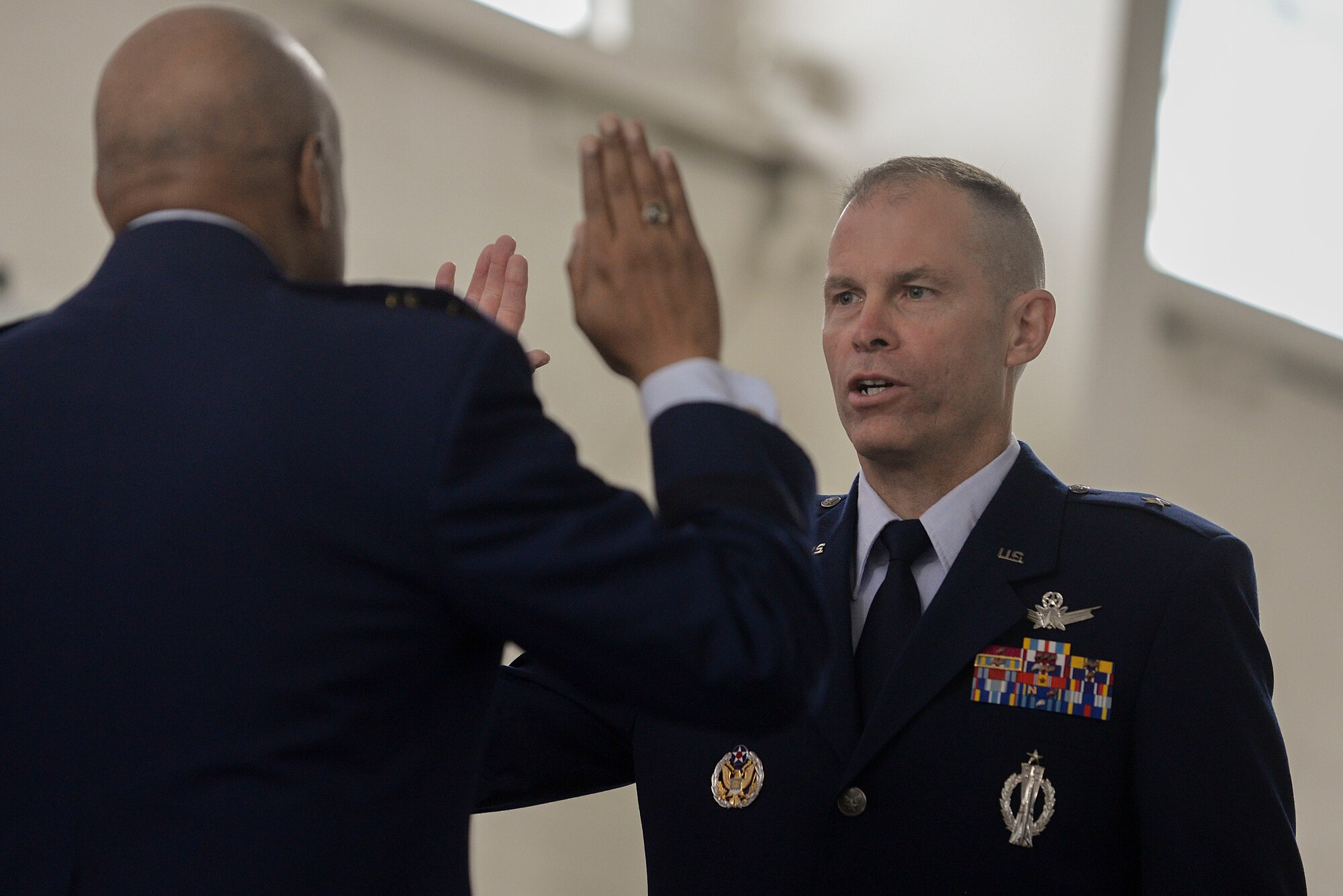 Brig. Gen. Michael Lutton recites the oath of enlistment during his promotion ceremony to brigadier general at Minot Air Force Base, N.D., June 17, 2016. Lutton recently relinquished command of the 91st Missile Wing to Col. Colin Connor. (U.S. Air Force photo/Airman 1st Class Jessica Weissman) 