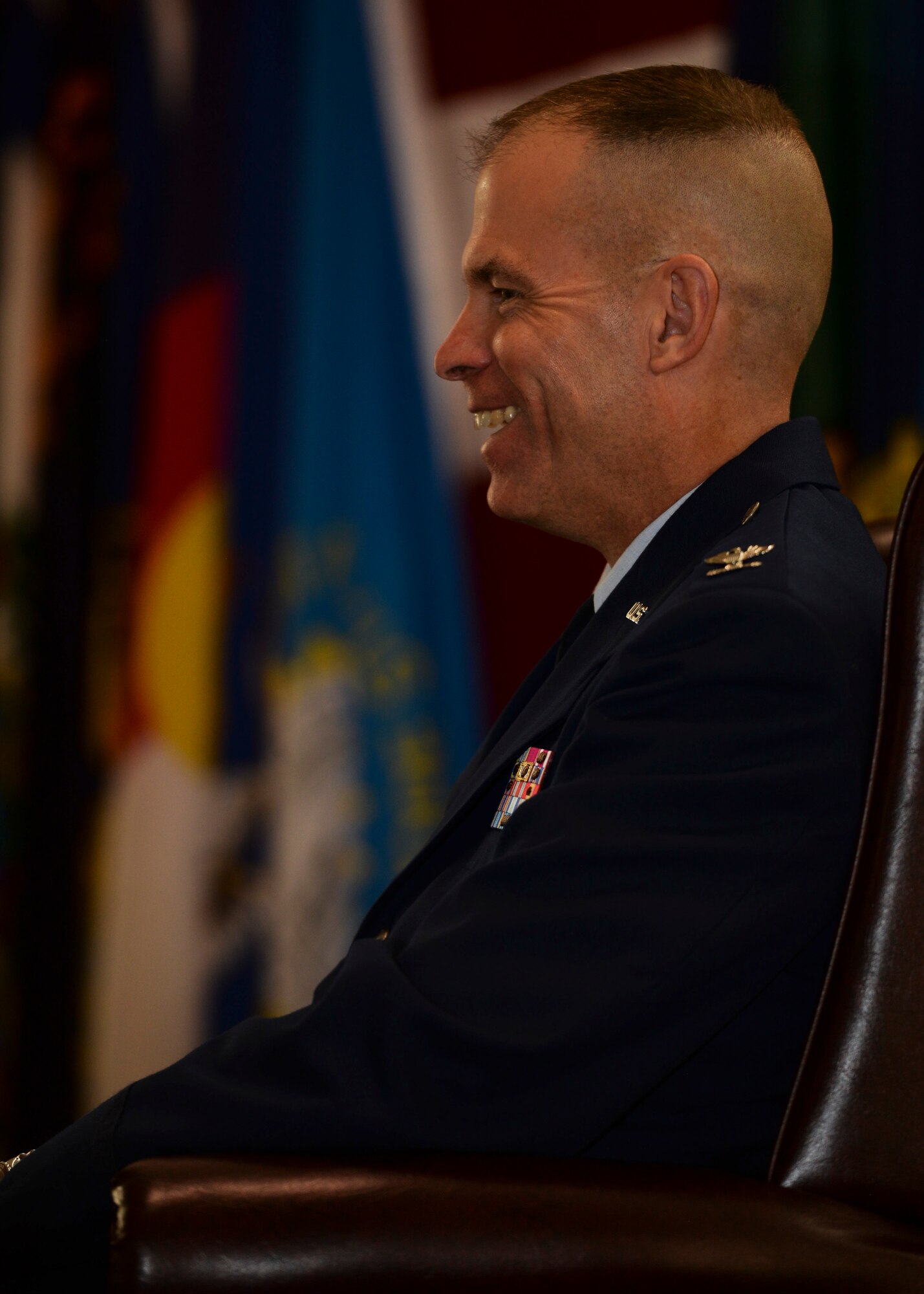 Col. Michael Lutton, previous 91st Missile Wing commander, laughs during his promotion ceremony at Minot Air Force Base, N.D., June 17, 2016. Lutton was selected to be promoted in December 2015. (U.S. Air Force photo/Airman 1st J.T. Armstrong)