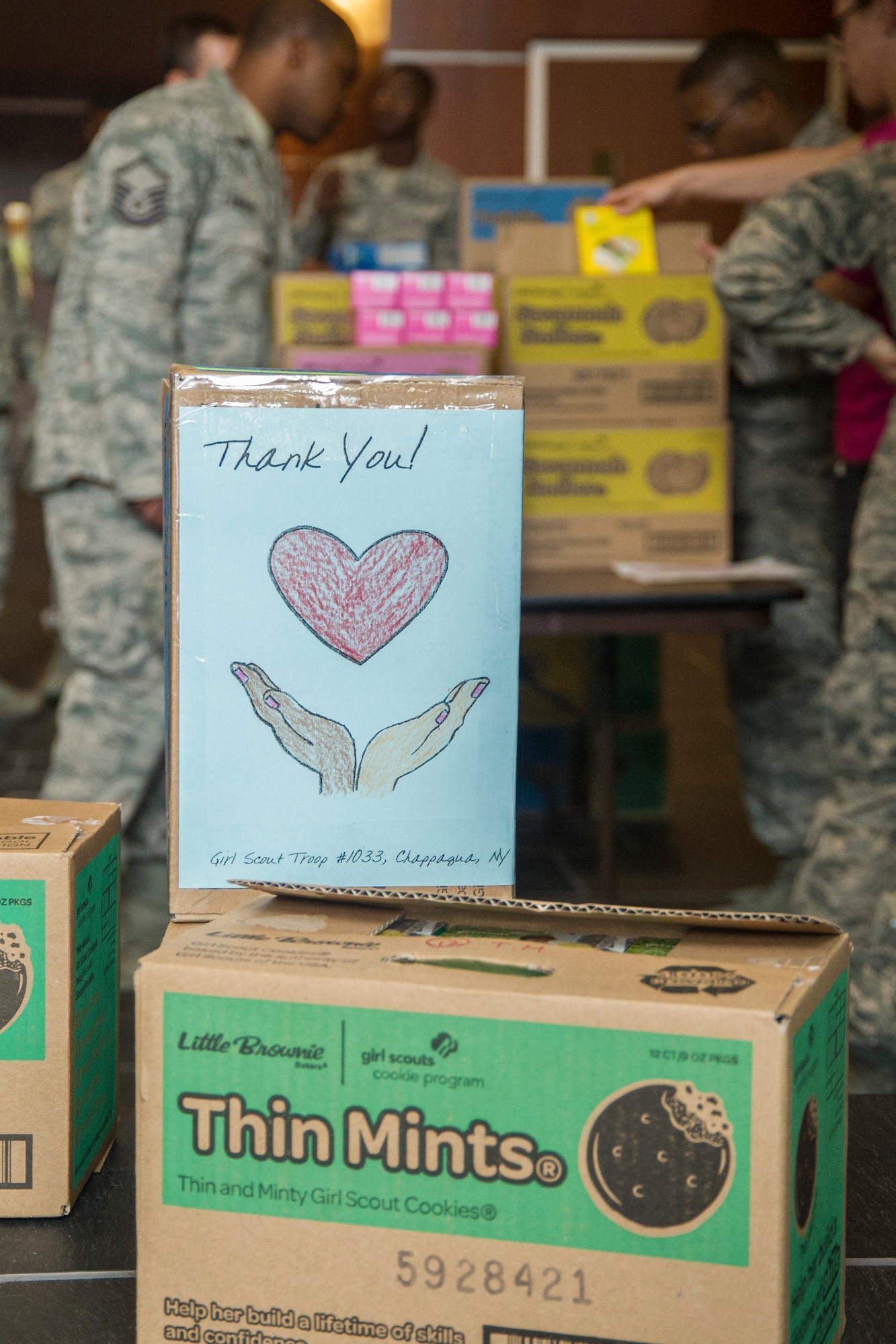 A handmade ‘thank you’ note is displayed with boxes of Girl Scout Cookies at Joint Base Andrews, Md., June 15, 2016. Notes were made by Girl Scout Troops and put in with the boxes of cookies delivered to base. (U.S. Air Force photo by Airman Gabrielle Spalding)