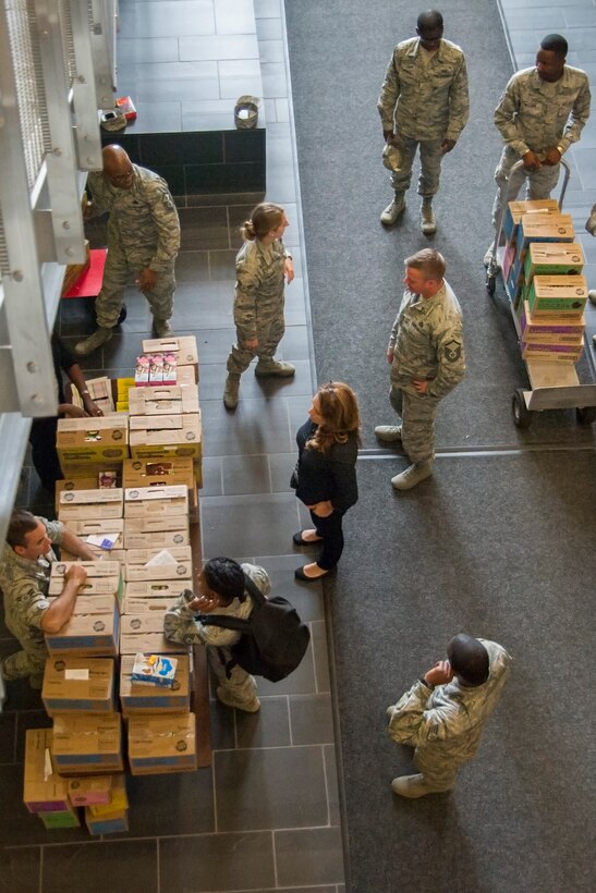 Members of Joint Base Andrews, Md., assist with distribution of Girl Scout Cookies on base, June 15, 2016. Volunteers from the six wings on JBA helped with the breakdown and delivery of approximately 5,000 boxes of cookies. (U.S. Air Force photo by Airman Gabrielle Spalding)