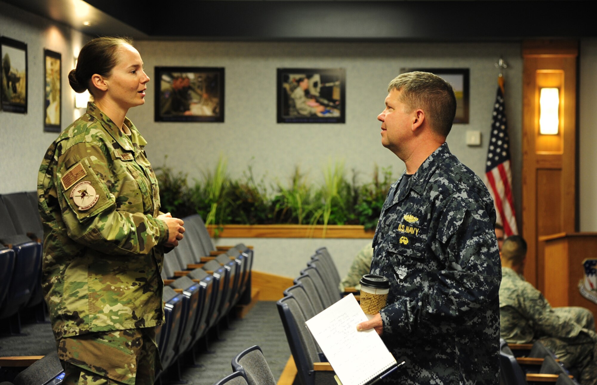 U.S. Navy Rear Adm. Thomas Ishee (right), U.S. Strategic Command’s (USSTRATCOM) Joint Functional Component Command for Global Strike deputy commander, listens as U.S. Air Force Staff Sgt. Kathleen Hastings, 341st Missile Security Forces Squadron security forces member, asks a question at a U.S. Strategic Command Road Show held at the 341st Missile Wing Headquarters Building, June 8, 2016, at Malmstrom Air Force Base, Mont. The road show is a USSTRATCOM outreach effort designed to show service members how their role fits into USSTRATCOM’s strategic deterrence mission. Over 250 Airmen and spouses attended events discussing Malmstrom’s role in strategic deterrence, new threats in the world and how we maintain nuclear forces. One of nine DoD unified combatant commands, USSTRATCOM has global strategic missions, assigned through the Unified Command Plan, which include strategic deterrence; space operations; cyberspace operations; joint electronic warfare; global strike; missile defense; intelligence, surveillance and reconnaissance; combating weapons of mass destruction; and analysis and targeting. (U.S. Air Force photo/2nd Lt. Annabel Monroe)