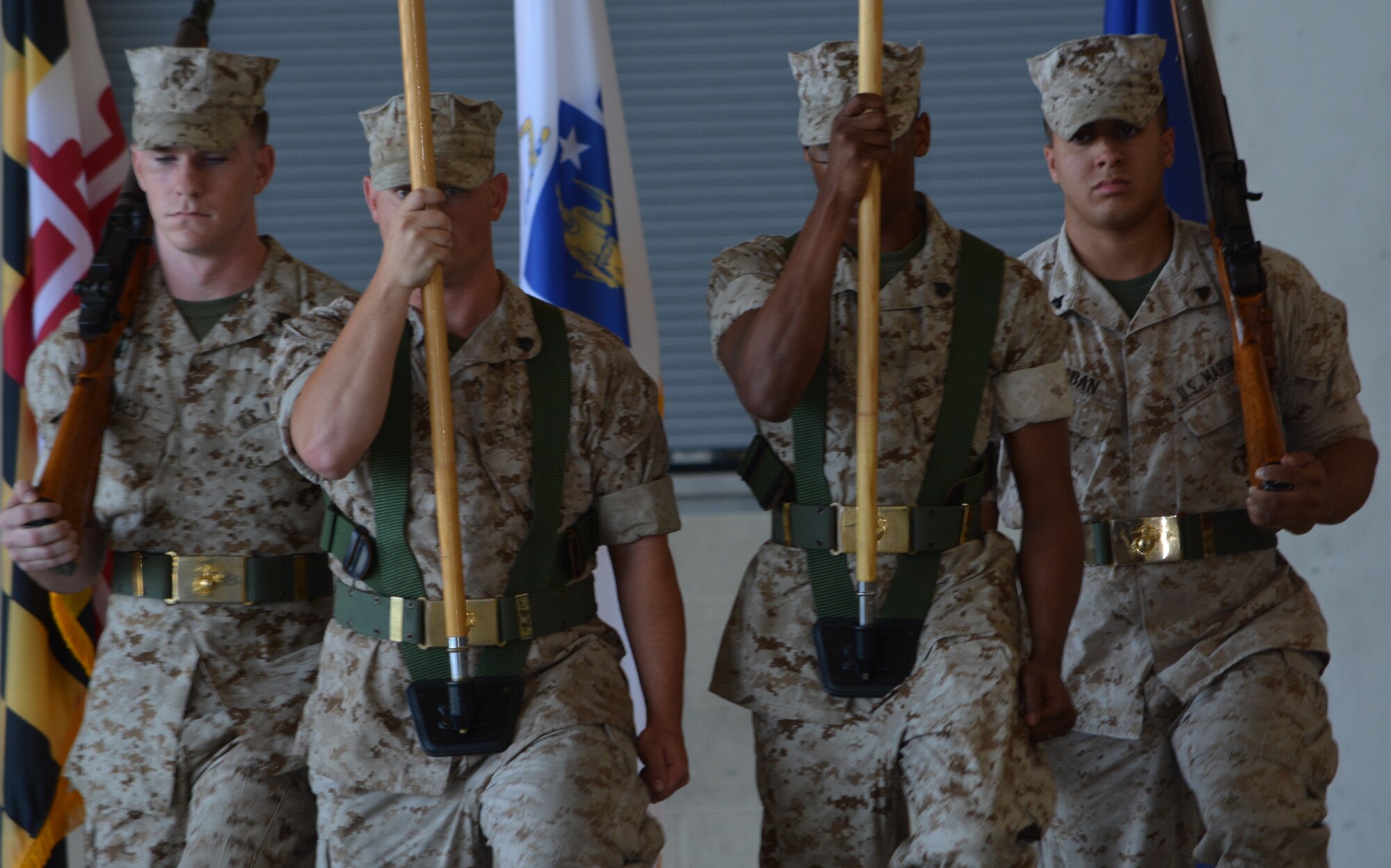 The Honor Guard posts the colors during the deactivation of Marine Aircraft Group-49 Detachment Alpha and consolidation of Marine Light Attack Helicopter Squadron 773 (minus) ceremonies Thursday. (U.S. Air Force photo by Kenya Askew)
