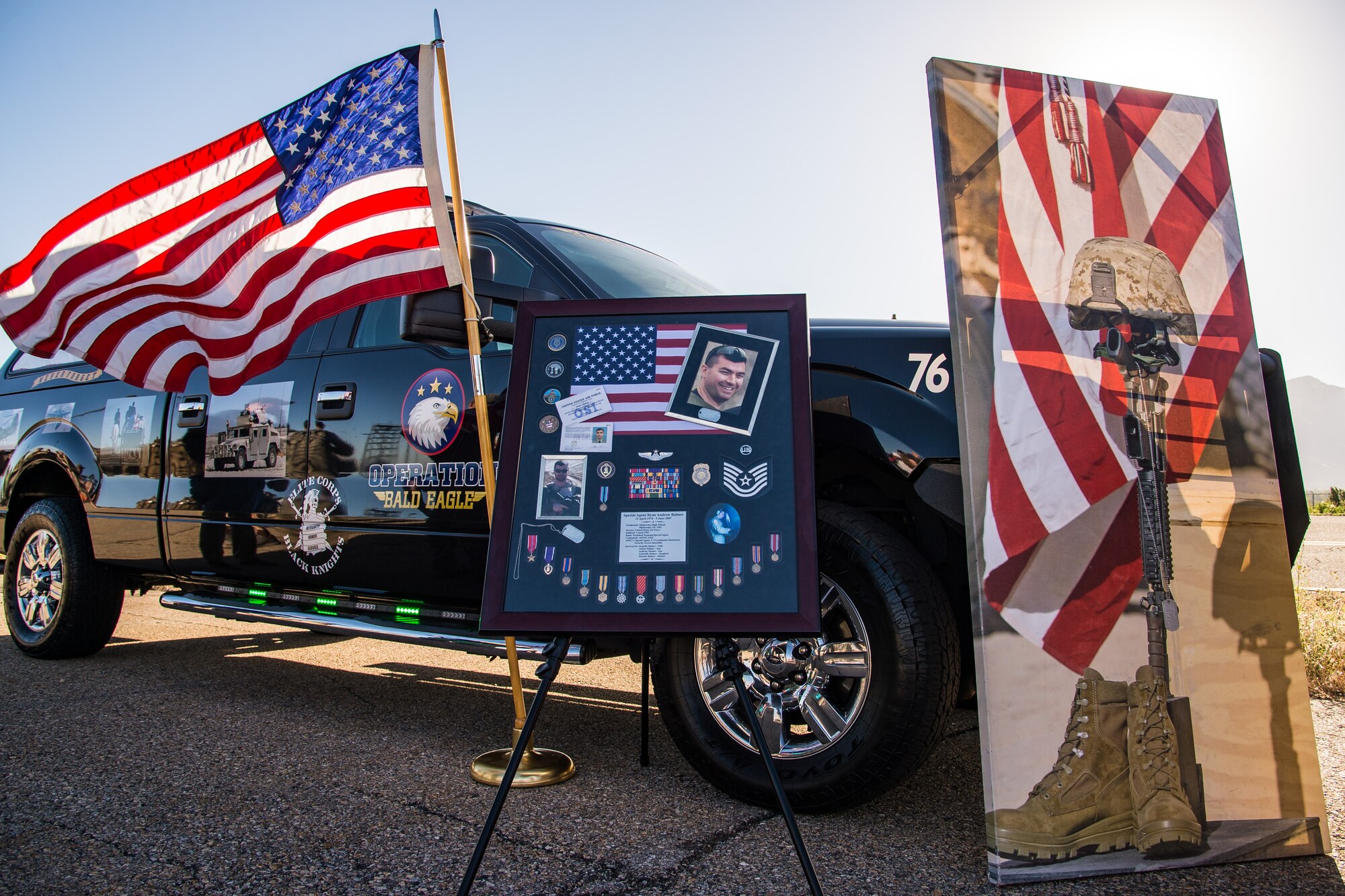A display honoring Special Agent Ryan Balmer stands at the starting line of the Hill Air Force Base Office of Special Investigation’s 9th Annual Ruck March, June 17, 2016. The event honored Special Agent Ryan Balmer who was killed in action by an improvised-explosive device near Kirkuk Regional Air Base, Iraq, June 5, 2007. Balmer was posthumously awarded the Bronze Star, the Combat Action Medal, the Iraq Campaign Medal, and the Air Force Commendation Medal.