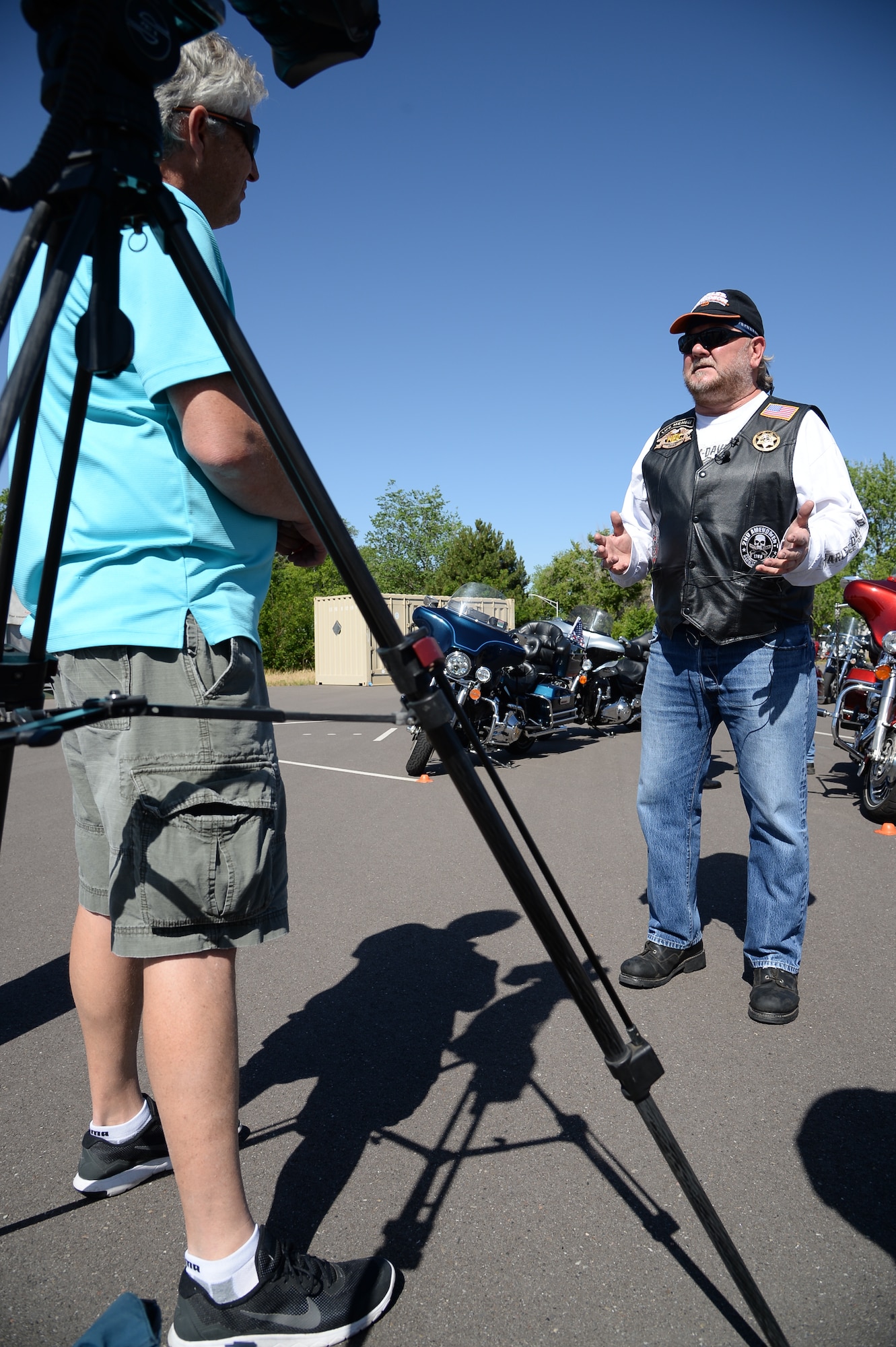 Hill AFB's Motorcycle Safety Program Manager, Allan Woods, talks with media before the “See me, Save me” ride on and around Hill Air Force Base, June 16. Two hundred motorcyclists participated in the 7th annual safety campaign ride. (U.S. Air Force photo by R. Nial Bradshaw)
