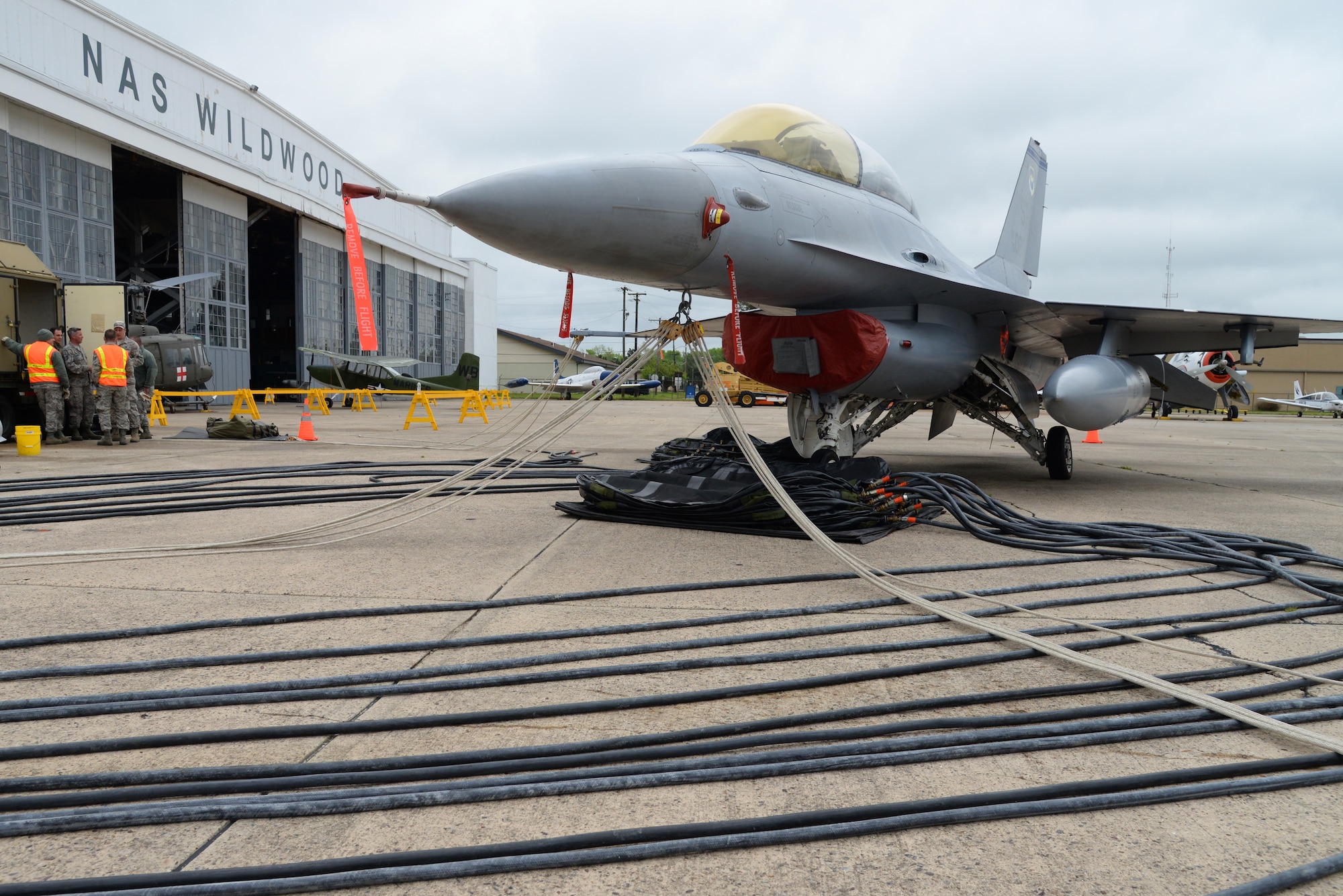 A picture of a decommissioned U.S. Air Force F-16D Fighting Falcon sitting at the Naval Air Station Wildwood Aviation Museum.