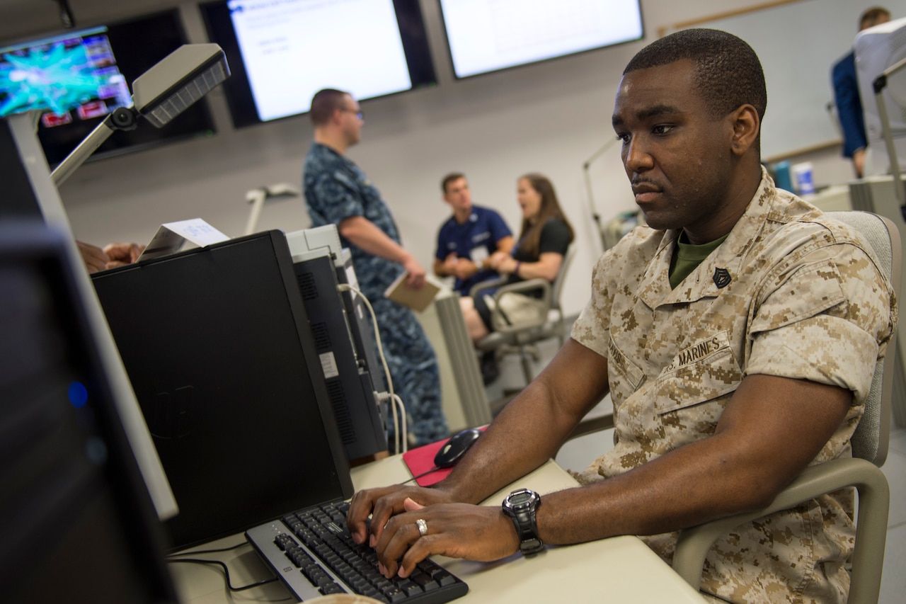 A participant at Cyber Guard 2016 works through a training scenario during the nine-day exercise Suffolk, Va., June 16, 2016. Navy photo by Petty Officer 2nd Class Jesse Hyatt