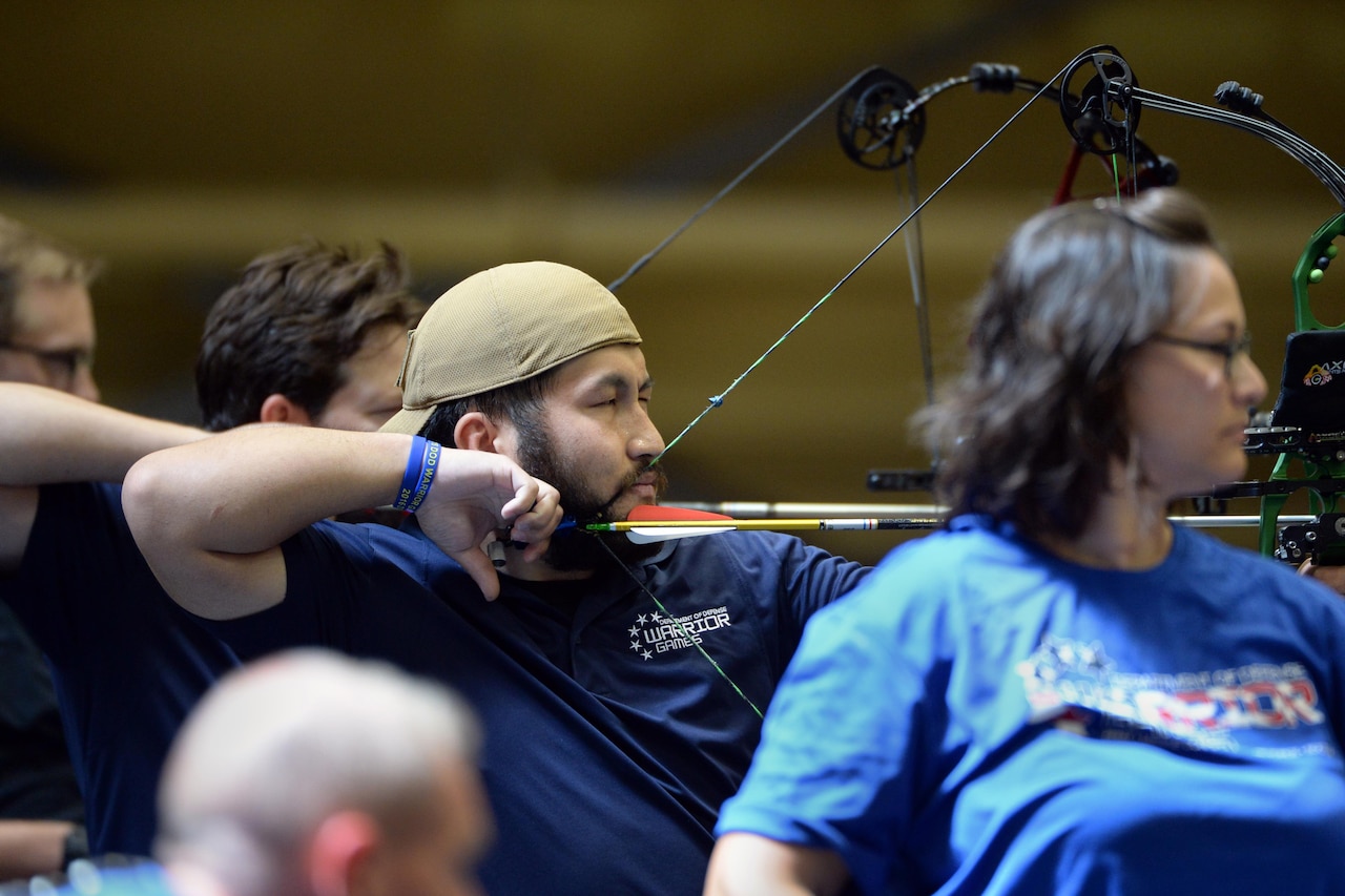 Retired Navy Petty Officer 2nd Class Roel Espino draws his bow during the 2016 Department of Defense Warrior Games at the U.S. Military Academy in West Point, N.Y., June 17, 2016. DoD photo by EJ Hersom
