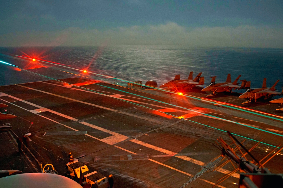 An F/A-18 Super Hornet lands aboard the USS John C Stennis during flight operations in the Philippine Sea, June 18, 2016. The Nimitz-class aircraft carriers Stennis and USS Ronald Reagan are providing security and stability in the Indo-Asia-Pacific region. Navy photo by Petty Officer 3rd Class Matt Martino