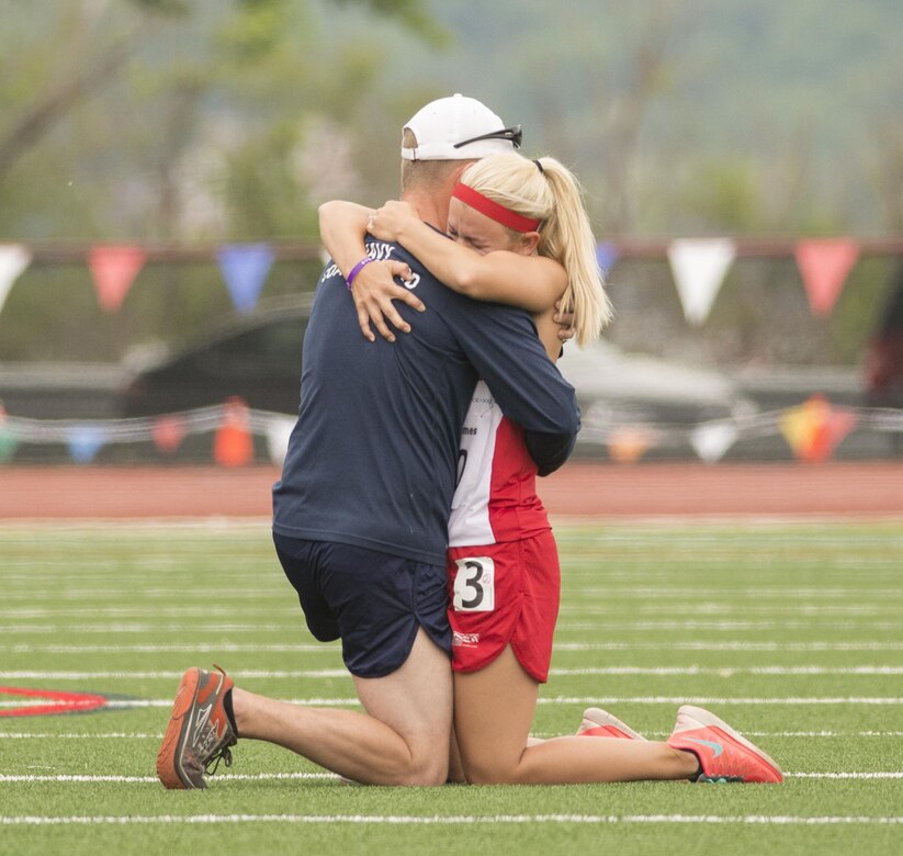 Navy veteran Andrew Johnson hugs Marine Corps veteran Rose Jessica Hammack after she accepted his marriage proposal during the 2016 Department of Defense Warrior Games at the U.S. Military Academy in West Point, N.Y., June 16, 2016. DoD photo by Roger Wollenberg