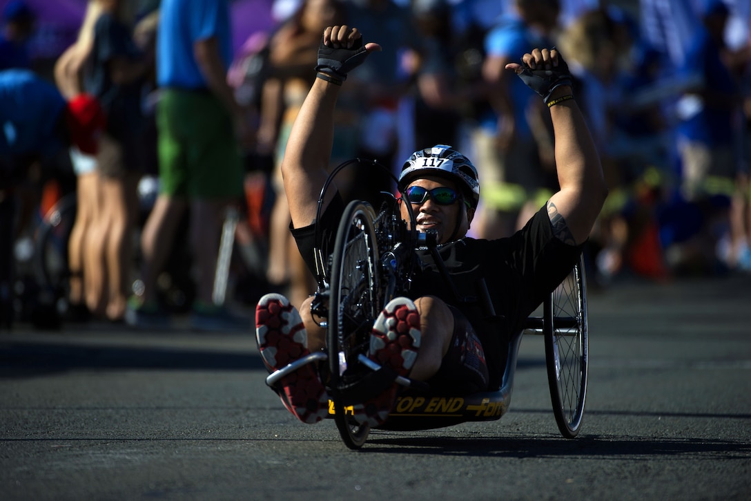 Army veteran David Iuli reacts to crossing the finish line at the 2016 Department of Defense Warrior Games cycling course at the U.S. Military Academy in West Point, N.Y., June 18, 2016. DoD photo by EJ Hersom